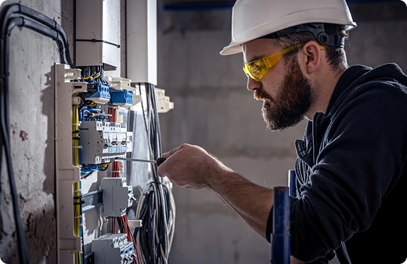 Electrician troubleshooting circuit breakers